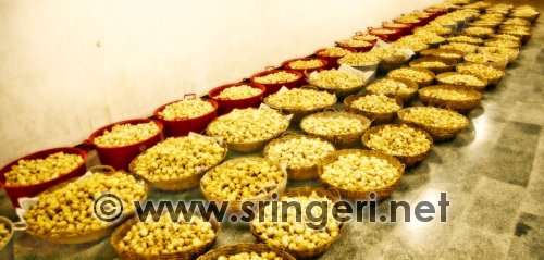 Modakas stacked in baskets in the Math Kitchen for the Homam