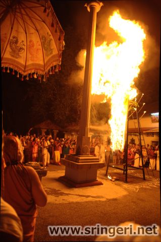 The Jagadguru Mahaswamiji witnessing the Jwaalaa Thorana during the occasion of Kartika Deepotsava